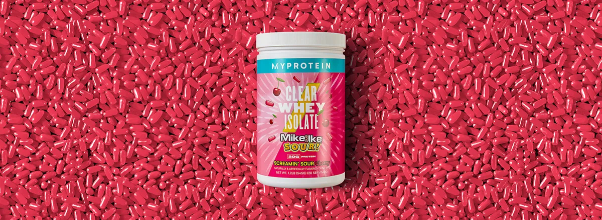 Myprotein Clear Whey Isolate tub on red candy